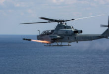 AH-1Z Viper attack helicopter fires a Hellfire missile