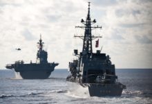 The Japan Maritime Self Defense Force Izumo-class helicopter destroyer JS Izumo and the Murasame-class destroyer JS Murasame