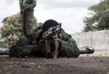 New recruits for the Central African Armed Forces (FACA) perform a drill during a medal presentation demonstration in Berengo on August 4, 2018