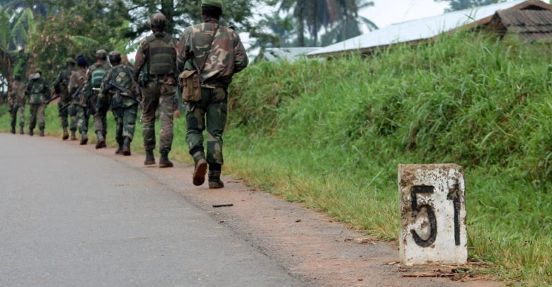 Democratic Republic of Congo soldiers march on December 31, 2013 in Eringeti towards the front line in Beni to fight against the Allied Democratic Forces.