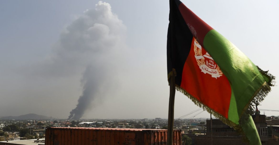 Smoke rises from the site of an attack after a massive explosion the night before near the Green Village in Kabul, September 2019