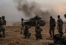 Turkish-backed Syrian fighters alongside Turkish soldiers in the Syrian city of Manbij.