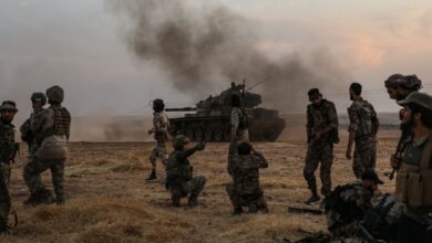 Turkish-backed Syrian fighters alongside Turkish soldiers in the Syrian city of Manbij.