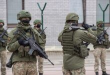 A Lithuanian soldier seen carrying a M72 unguided anti-tank training weapon