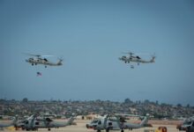 Two MH-60R Seahawks helicopters participated in a formation flyover during a ceremony where the Indian Navy received its first two MH-60Rs from the US Navy