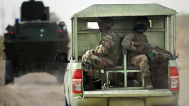 Nigerian soldiers patrolling Borno state near a former Boko Haram camp