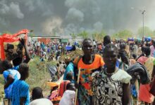 South Sudanese civilians flee fighting in the northeastern town of Malakal, where gunmen opened fire on people sheltering inside a United Nations base