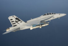 An F/A-18F Super Hornet assigned to the Salty Dogs of Air Test and Evaluation Squadron (VX) 23 conducts a captive carry flight test of an AGM-88E Advanced Anti-Radiation Guided Missile at Naval Air Station Patuxent River, Md. (U.S. Navy photo by: Greg L. Davis)