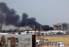 Heavy smoke billows above buildings in the Sudanese capital