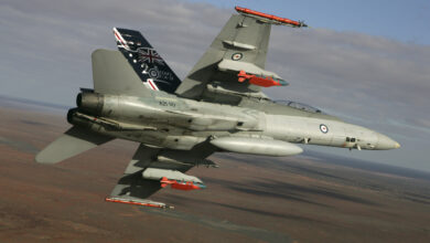 A Royal Australian Air Force F/A-18 Hornet in flight with two JDAM-ER 500lb bombs and two Time Space Position Information pods. Deep cap: TESTS OF EXTENDED RANGE 'SMART' BOMBS The Department of Defence, in conjunction with Hawker de Havilland and The Boeing Company, has conducted the successful initial testing of an extended range Joint Direct Attack Munition (JDAM) variant. The successful tests were conducted at Woomera, South Australia, in mid August. The development activity was conducted under the Concept Technology Demonstrator (CTD) Program managed by the Defence Science and Technology Organisation (DSTO). The Joint Direct Attack Munition Extended Range (JDAM-ER) is a conventional JDAM, enhanced with an Australian designed wing kit which has the potential to significantly increase its range. The wing kit was developed by Hawker de Havilland, based on technology licensed from DSTO.
