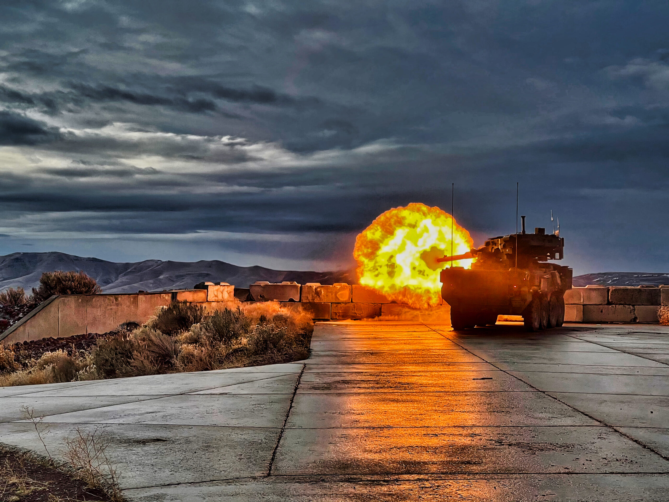 U.S. Army Stryker M1128 Mobile Gun System assigned to 8th Squadron, 1st Cavalry Regiment fires a canister round at Yakima Training Center as part of Table VI gunnery qualification. Table VI is key to sustaining a qualified and ready crew. (U.S. Army photo by 1st Lt. Alex Windmiller)