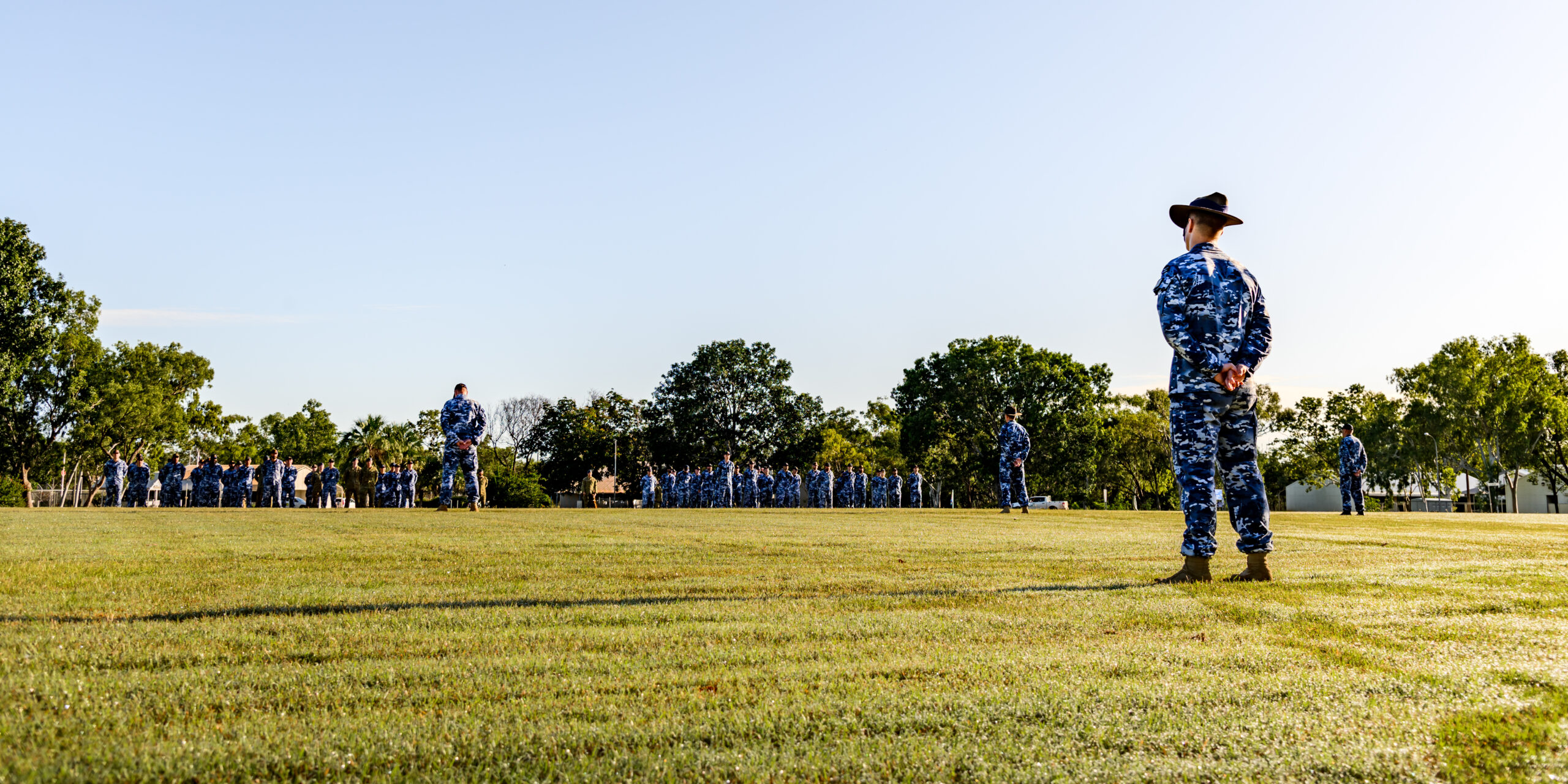 At RAAF Base Tindal, Northern Territory, personnel from No. 17 Squadron stand on parade during the Change of Command ceremony. *** Local Caption *** Wing Commander Shane Smith retired from the ADF after 41 years of service, handing over command of No. 17 Squadron and the role of Senior Australian Defence Force Officer at RAAF Base Tindal. The parade and ceremony on 10 March 2023 celebrated Wing Commander Smiths long career and welcomed the incoming Commanding Officer, Wing Commander Fiona Pearce. Squadron and base personnel, alongside Katherine community leaders, praised Wing Commander Smiths leadership during this defining period in RAAF Base Tindals history.