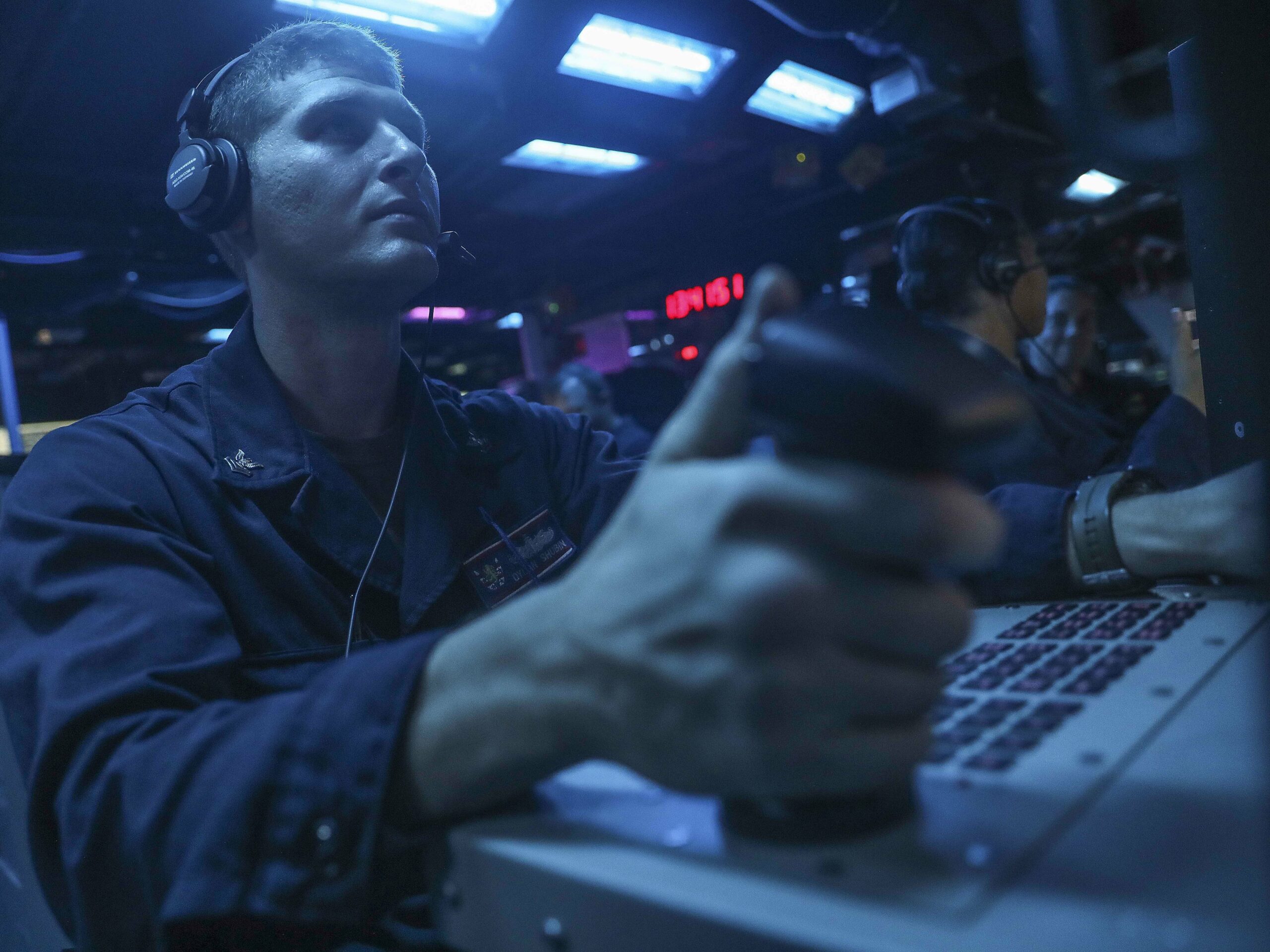 220828-N-UA460-1019 PHILIPPINE SEA (Aug. 28, 2022) – Fire Controlman 2nd Class Dylan Shubin, from Norco, California, mans a console in the combat information center aboard Arleigh Burke-class guided-missile destroyer USS Barry (DDG 52) during live-fire missile exercise as part of Pacific Vanguard (PV) 2022 while operating in the Philippine Sea, Aug. 28. PV22 is an exercise with a focus on interoperability and the advanced training and integration of allied maritime forces. (U.S. Navy photo by Mass Communication Specialist 1st Class Greg Johnson)