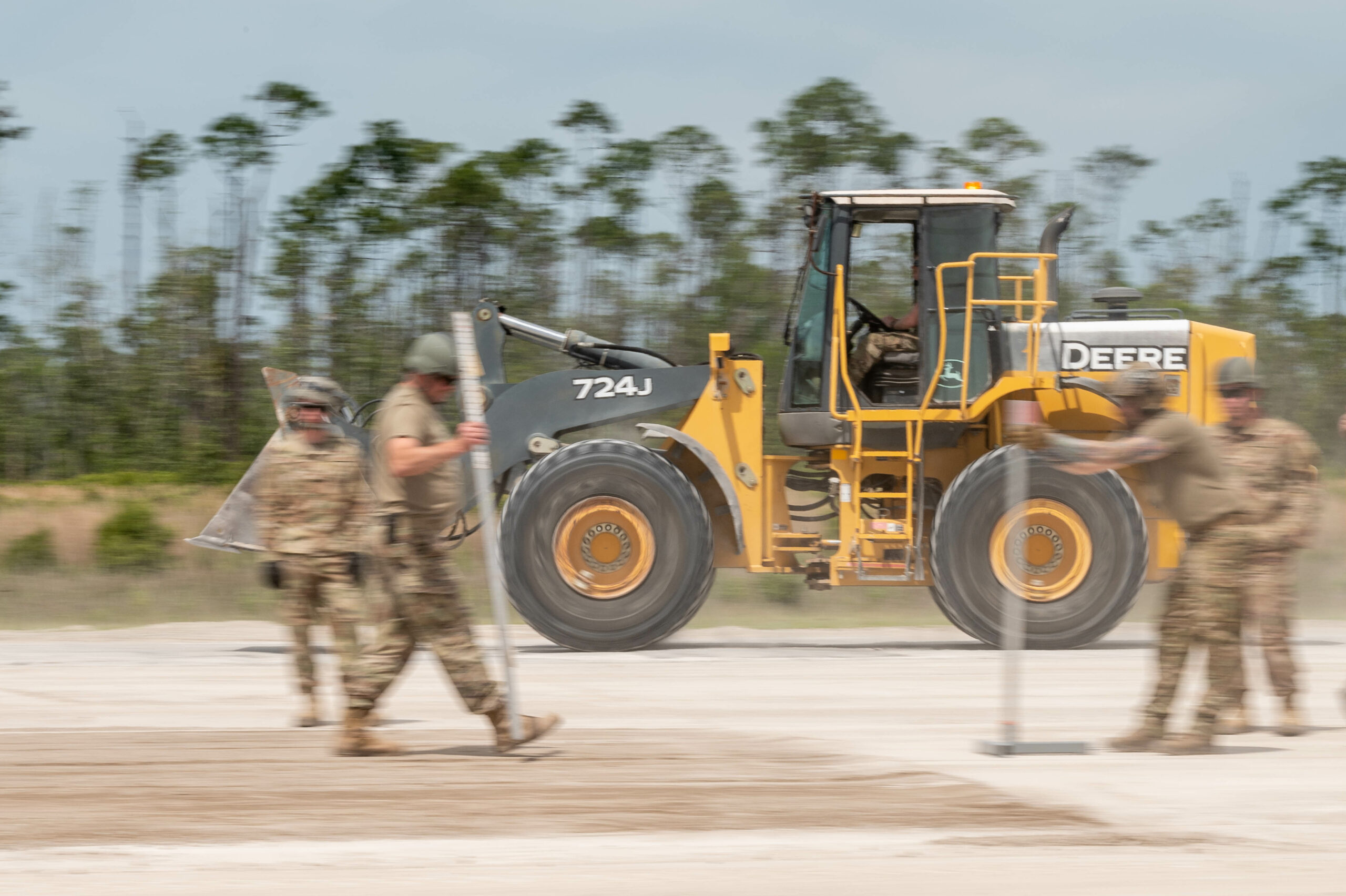 Members of with the 914th Civil Engineer Squadron, Air Force Reserve Command, attempt an airfield damage crater repair at Readiness Challenge IX in Tyndall Air Force Base, Fla., April 25, 2023. Readiness Challenge is the capstone event for Department of the Air Force civil engineers to demonstrate their readiness and capability to conduct full-spectrum, integrated base response and recovery operations in contested, degraded and operationally limited environments. The Air Force Civil Engineer Center and the 801st RED HORSE Training Squadron, host the event and through the competition, are able assess unit readiness, find deficiencies and identify training opportunities to ensure the Air and Space Forces have ready trained civil engineers. (U.S. Air Force photo by Malcolm McClendon).