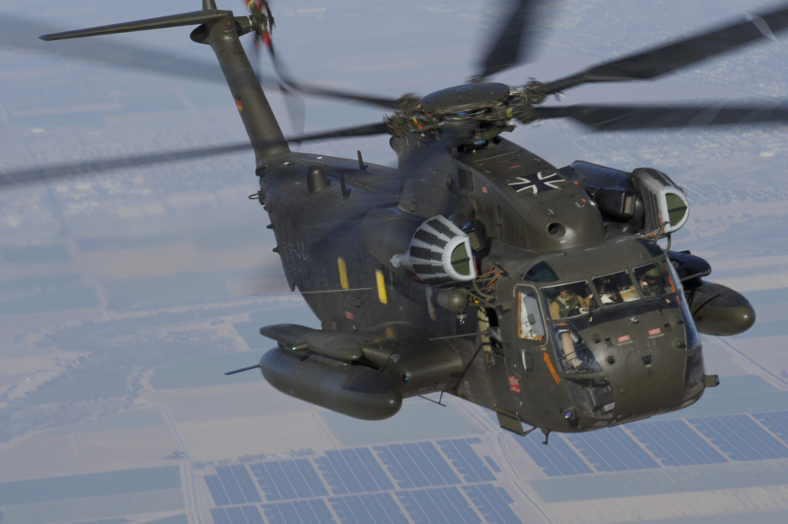 A German Air Force CH-53GS flies over southern Arizona during Angel Thunder 2015 June 7, 2015. Angel Thunder is the largest personnel recovery exercise in the world combining joint, coalition and interagency personnel. Participants train through the full spectrum of personnel recovery capabilities with numerous types of aircraft. (U.S. Air Force photo by Airman 1st Class Chris Massey/Released)