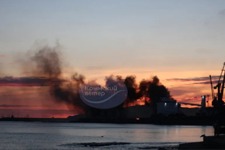 Smoke rising above a damaged warship after the Ukrainian attack on Russian-occupied southern Crimea