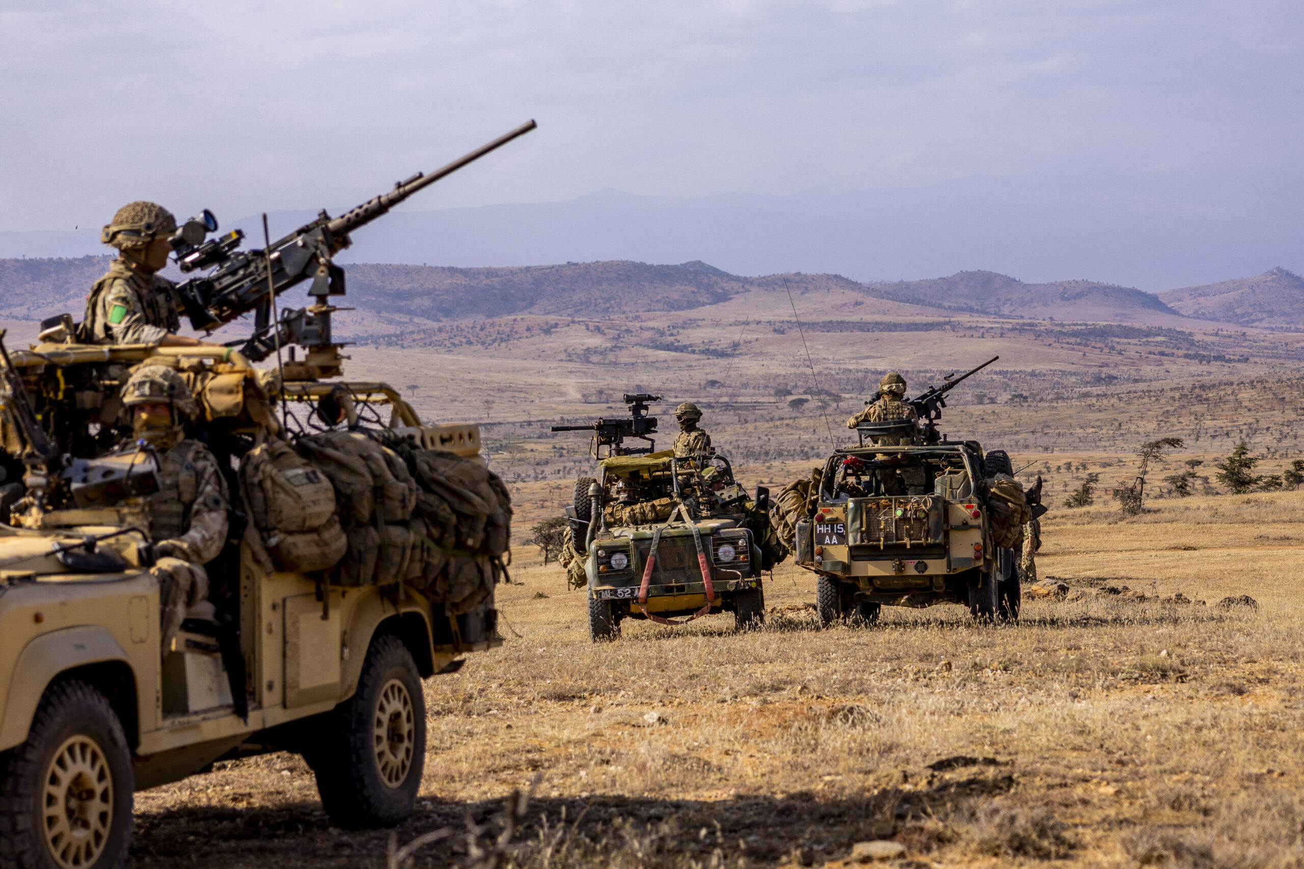 Members from Machine Guns Platoon, Support Company, 3rd Battalion, The Parachute Regiment, mounted in Revised Weapons Mounted Installation Kit (RWMIK) sat back in reserve ready to punch forward onto the objective during Exercise Haraka Storm, Kenya, on the 21st of July 2023.The British Armys global response force has tested its ability to deploy and fight at short notice in some of Africas most challenging environments. The soldiers of 3 PARA Battlegroup honed both their fighting and fieldcraft skills on the Kenyan savannah as part of the six-week long Exercise Haraka Storm. Dealing with the rough terrain, searing heat and potentially deadly animals - ranging from lions and elephants to scorpions and snakes  troops followed a progression of training, building from polishing their individual skills and specialities to a final mission which sees the whole force operating together to assault a heavily-defended objective. The 1,000-strong battlegroup is built around the airborne infantry of Colchester-based 3rd Battalion The Parachute Regiment, bolstered by artillery, engineers, signallers, medics, and logisticians from across 16 Air Assault Brigade Combat Team. Specially trained and equipped to deploy by parachute, helicopter or airlanding, the 3 PARA Battlegroup is currently held at very high readiness to respond to global crises. In April, it deployed to Sudan to provide security and logistic support to the evacuation of British civilians.