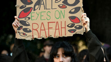 A demonstrator holds up a placard reading "All Eyes on Rafah" during a protest for Palestine