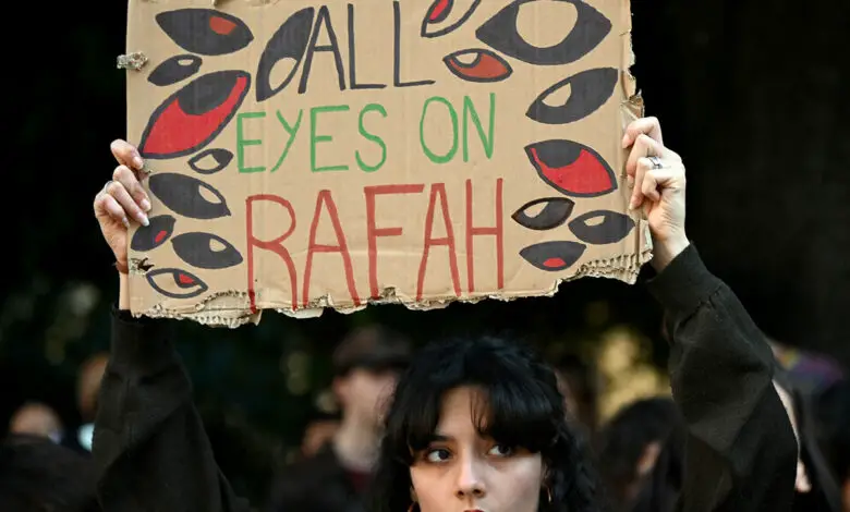 A demonstrator holds up a placard reading "All Eyes on Rafah" during a protest for Palestine