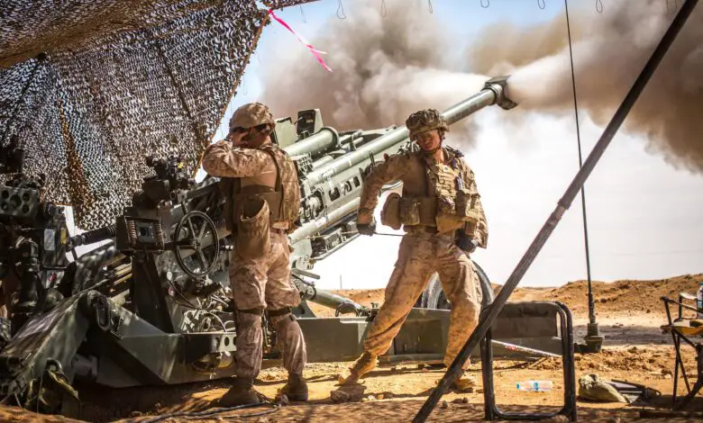 Marines with the 11th Marine Expeditionary Unit fire an M777 Howitzer during a fire mission in northern Syria as part of Operation Inherent Resolve