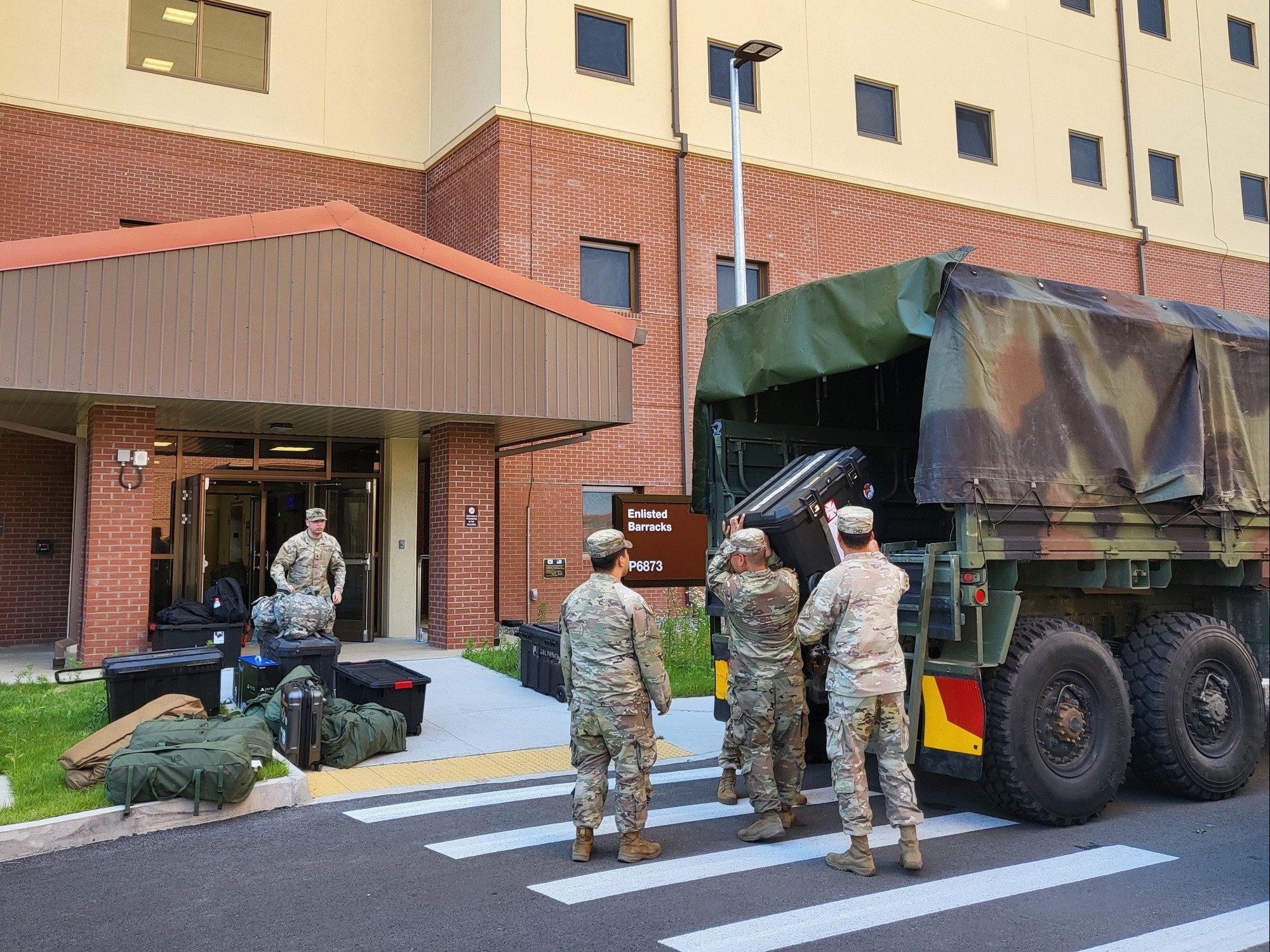 Soldiers move their belongings into a new barracks building on U.S. Army Garrison Humphreys, May 31, 2024. They bring their personnel items and equipment to their rooms, which have shared kitchens and bathrooms for every two Soldiers, along with four gazebos and a barbecue shelter outside. (US Army photo by Kim Chong-yun) (Chong Yun Kim)