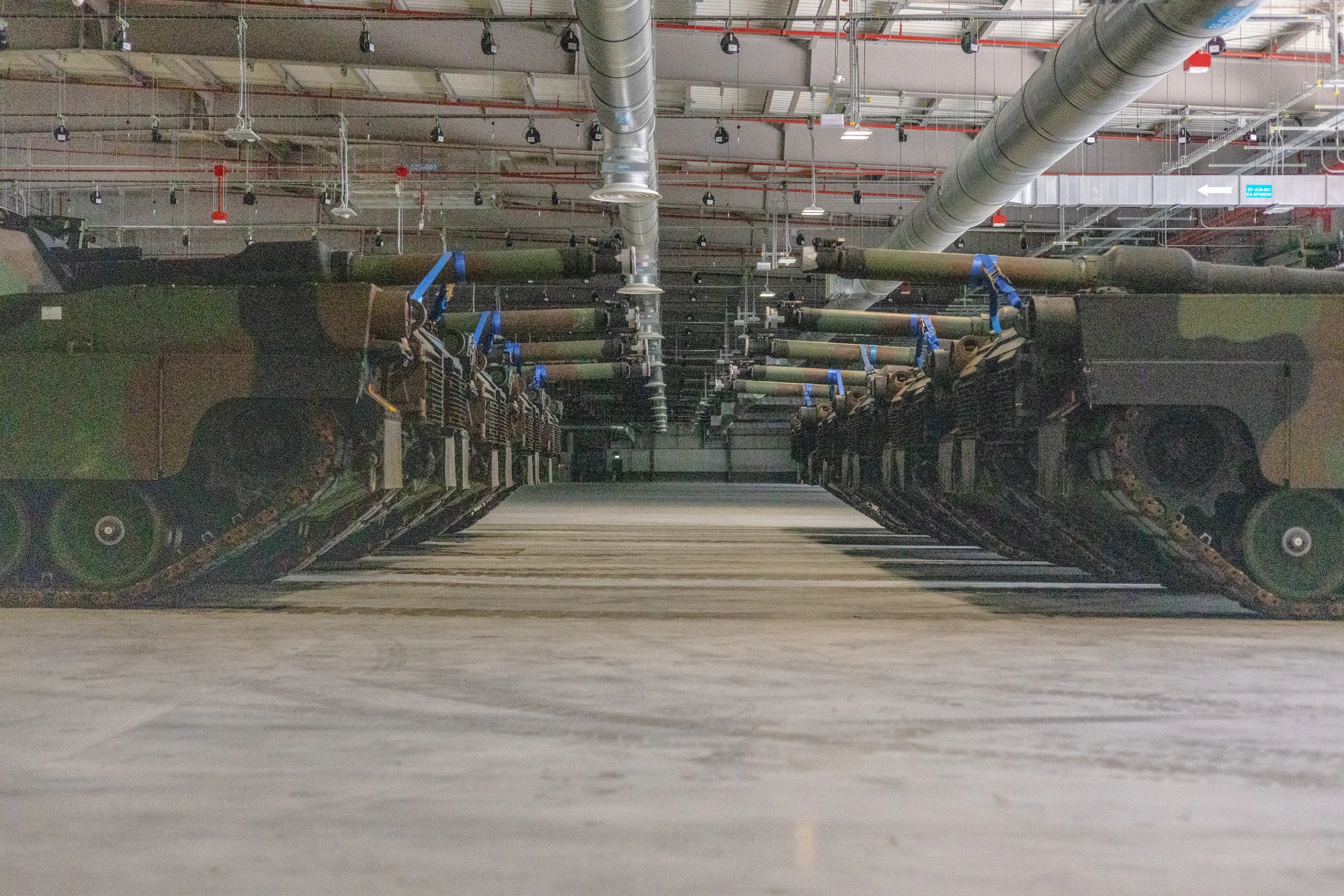 M1 Abrams tanks are positioned in the storage facility to maximize space at the Powidz APS-2 Worksite, Powidz, Poland, on June 28, 2024. The Powidz APS-2 Worksite enhances the Army’s ability to rapidly and dynamically employ forces within theater, improving deterrence capabilities and readiness.(U.S. Army photo by Capt. Michael Mastrangelo)