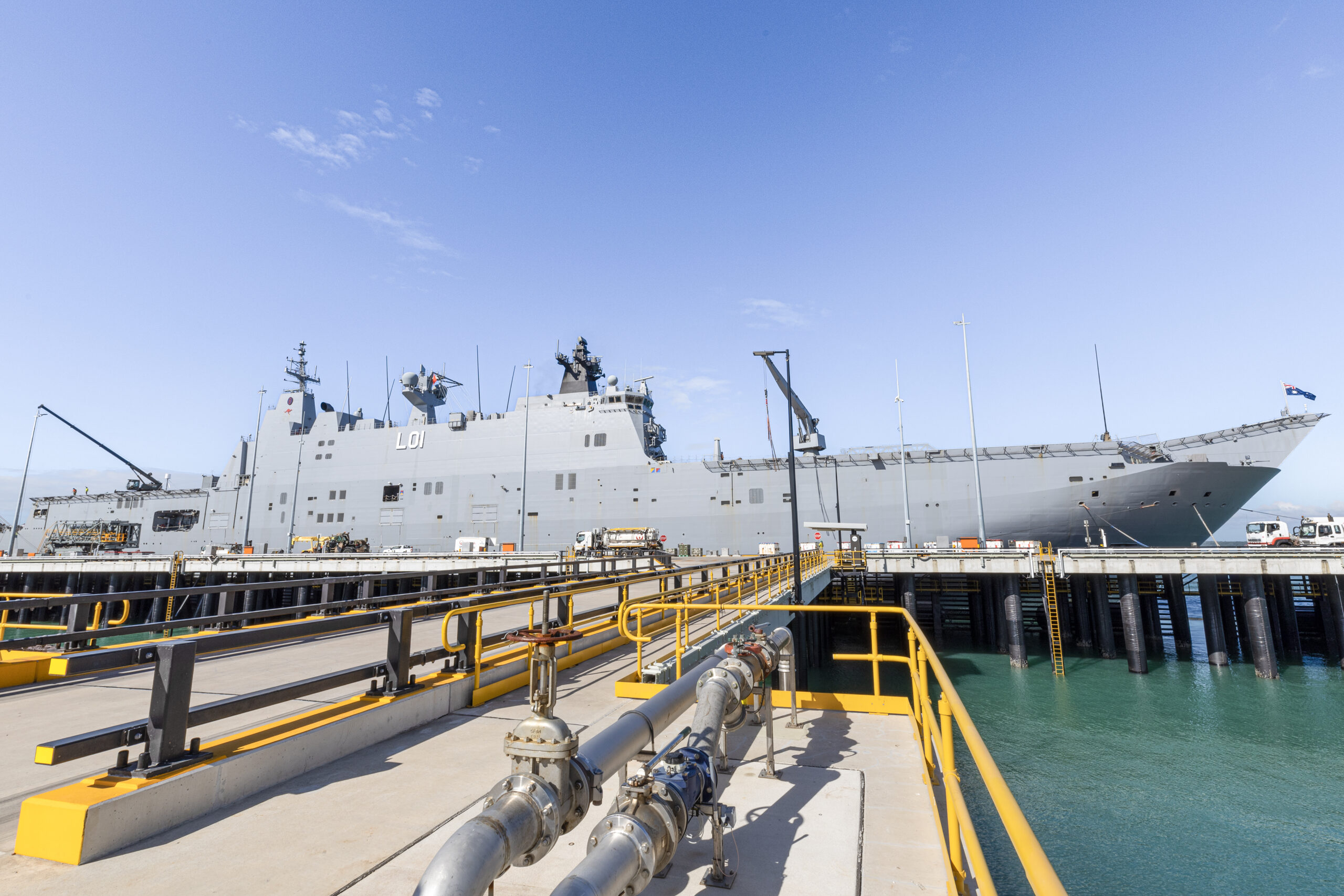 HMAS Adelaide berths alongside the new Kuru Wharf at HMAS Coonawarra in Darwin, NT. *** Local Caption *** HMAS Adelaide conducted the first Landing Helicopter Dock (LHD) sized berthing alongside the brand new Kuru Wharf at HMAS Coonawarra, Darwin, NT. This event marks a significant achievement regarding ongoing upgrades of waterfront facilities at Larrakeyah Defence Precinct. The Kuru Wharf measures at approximately 250 metres in length, with two approach jetties. The new wharf is now able to support up to Landing Helicoper Dock size naval vessels, providing game-changing capability support in the North.