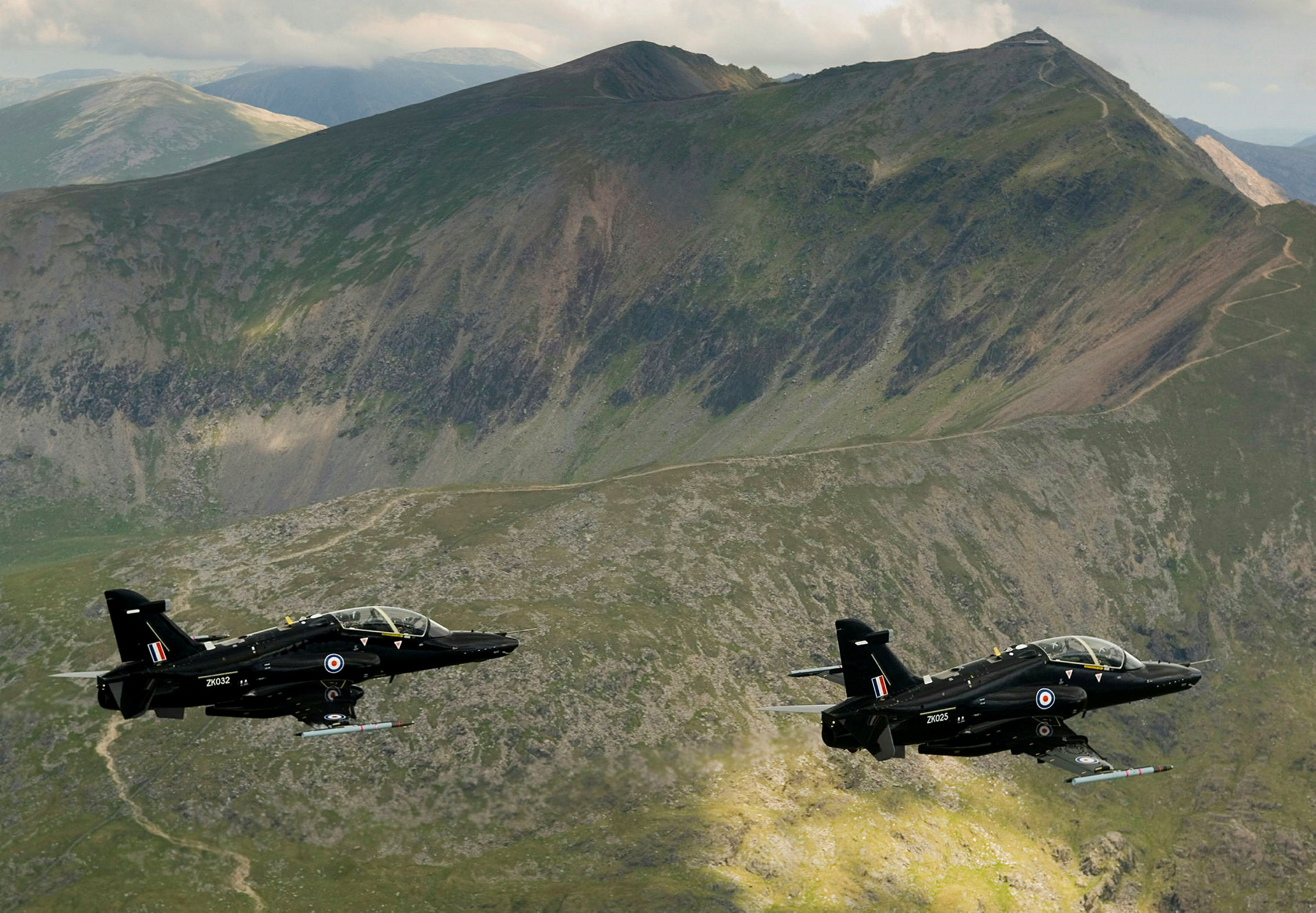 The RAF's latest fast jet trainer, the Hawk T2 is pictured during a flight over the beautiful scenery of North Wales. Based at RAF Valley on the Isle of Anglesey, the TMK2 Hawk is designed to train fast jet fighter pilots air combat and tactical weapons use, preparing them for front line operational aircraft like the Typhoon and Tornado.