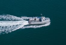 An 11m work boat moves at speed