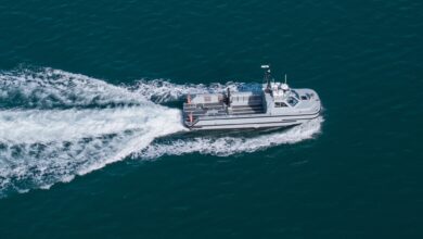 An 11m work boat moves at speed