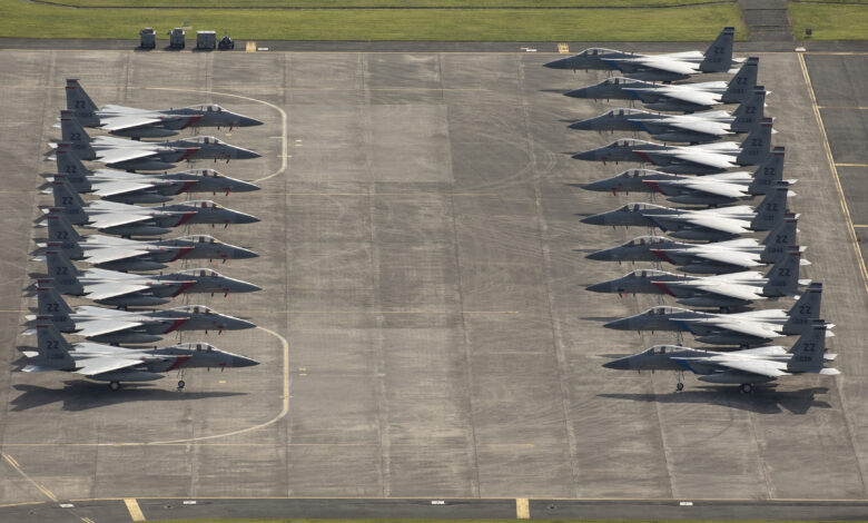 Eighteen U.S. Air Force F-15 Eagles from Kadena Air Base are parked on the ramp, July 9, 2018, at Yokota Air Base, Japan. The F-15s evacuated due to Typhoon Maria. This is the most aircraft to ever evacuate to Yokota AB from Kadena AB. (U.S. Air Force photo by Yasuo Oaskabe)