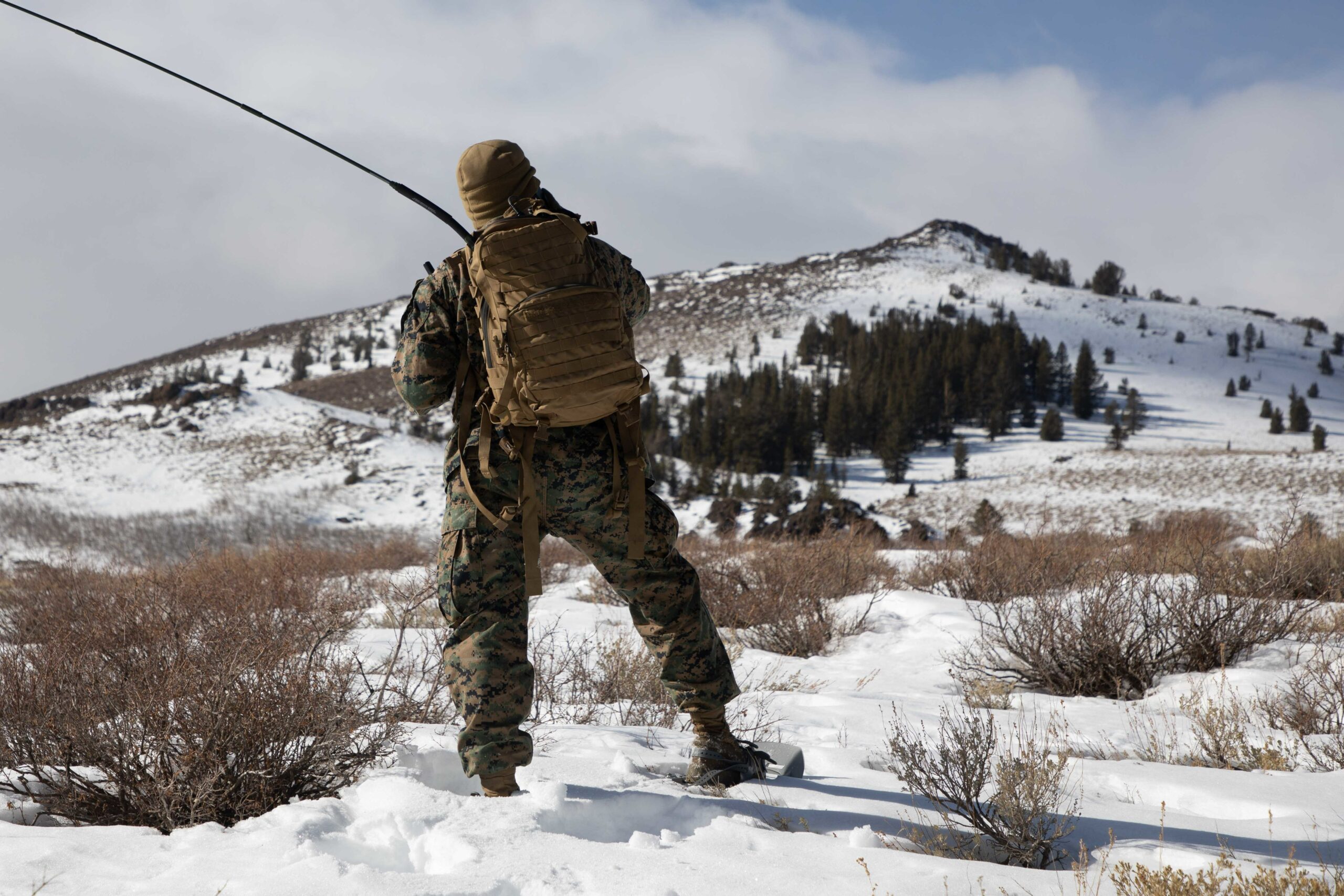 U.S. Marine Corps Pfc. Payton Deloach, a transmissions system operator with 2nd Maintenance Battalion, utilizes a AN/PRC-160 (V) manpack radio to perform various radio checks at the Marine Corps Mountain Warfare Training Center Bridgeport, California, during Mountain Training Exercise 2-21 Jan. 22, 2021. Marines train at the Mountain Warfare Training Center to prepare for the rigors of operating in harsh weather conditions, mountainous terrain and increased elevation. (U.S. Marine Corps Photo by Cpl. Adaezia L. Chavez)