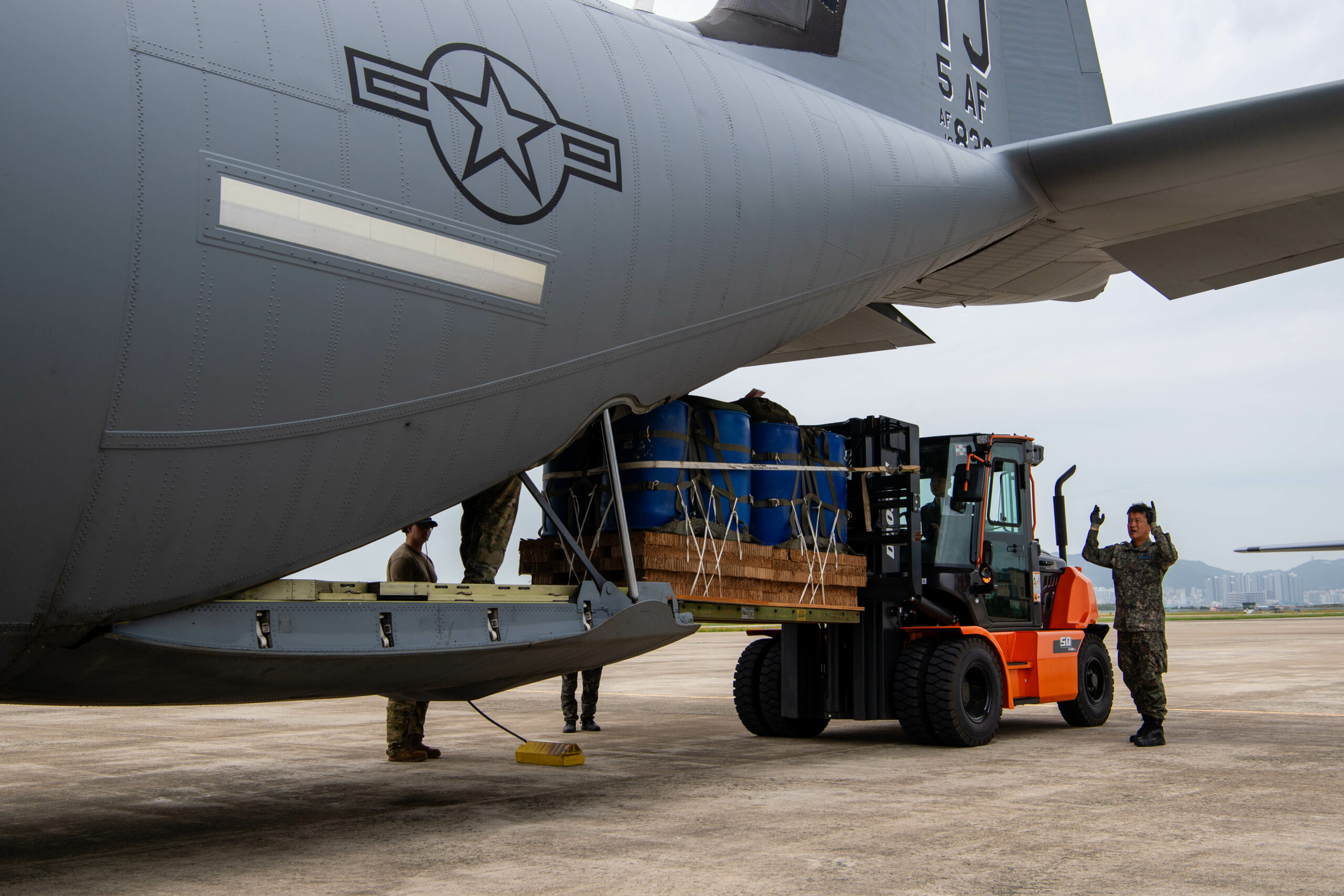 A member of the Republic of Korea Air Force loads container delivery system bundles onto a C-130J Super Hercules assigned to the 36th Airlift Squadron in preparation for an airdrop training event at Gimhae Air Base, Republic of Korea, June 25, 2024. Combined training demonstrates the U.S. commitment to the Republic of Korea and is the foundation for maintaining a combined defense posture to ensure a free and open Indo-Pacific region. (U.S. Air Force photo by Senior Airman Natalie Doan)