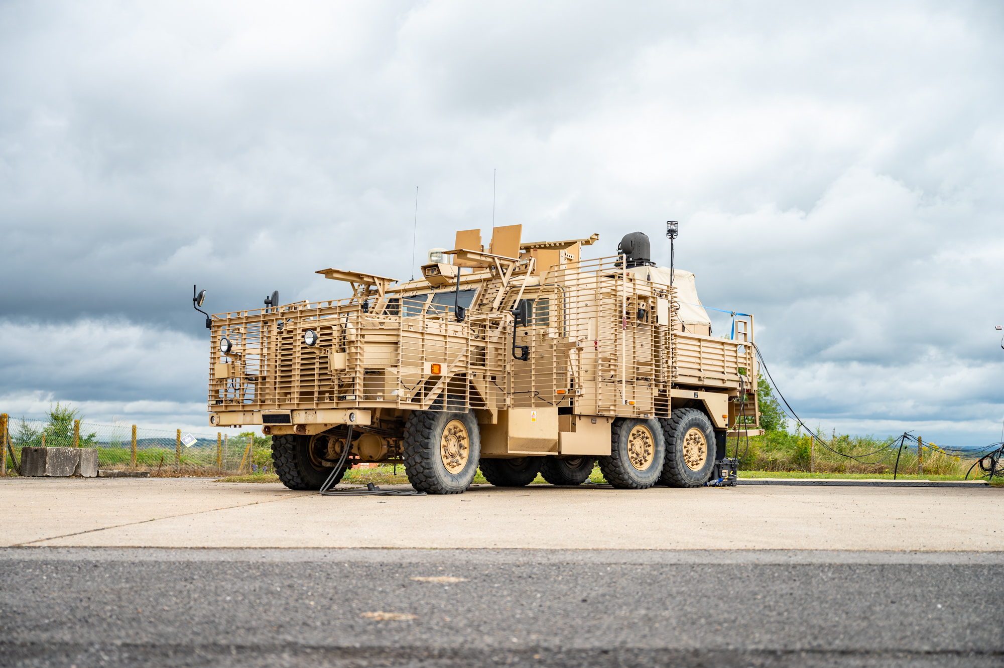 Image a British Army Wolfhound armoured vehicle, seen here with a mounted portable Laser Directed Energy Weapon (LDEW). For the first time scientists and engineers have successfully fired a high powered laser energy weapon from a British Army combat vehicle. This ground-breaking test, conducted at Dstls range in Porton Down, saw the laser weapon neutralise targets at distances in excess of 1km. The high-energy laser weapon mounted on to a British Army Wolfhound armoured vehicle, represents a major leap forward in the UK Ministry of Defences Land Laser Directed Energy Weapon (LDEW) Demonstrator programme, providing increased operational advantage on the battlefield.