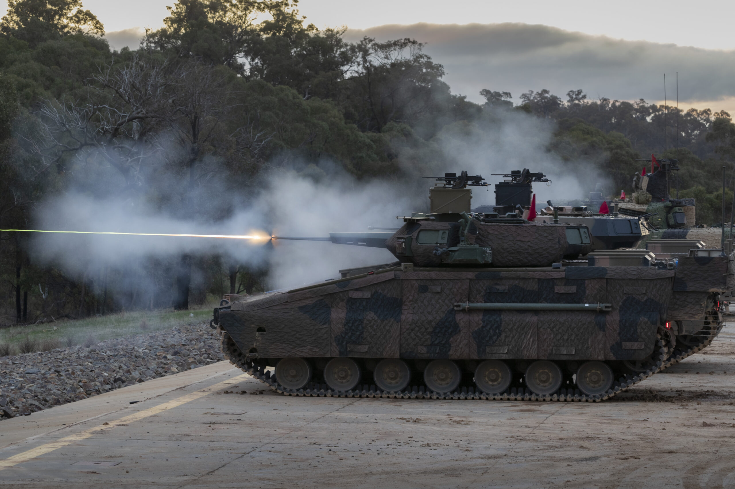 Hanwha Defense Australia Redback Infantry Fighting Vehicles conduct a live fire demonstration during LAND 400 Phase 3 user evaluation trials at Puckapunyal Military Area, Victoria. *** Local Caption *** Valued at between $18.1 billion and $27.1 billion, LAND 400 Phase 3 is the largest acquisition project in the Australian Armys history. The contenders for a new Infantry Fighting Vehicle are the Hanwha Defense Australia Redback and the Rheinmetall Defence Australia KF41 Lynx. Both tenderers have each delivered three prototype vehicles which are being extensively tested as part of a two-year Risk Mitigation Activity. Captured in this collection are activities undertaken at Puckapunyal, Victoria in June 2021, including extensive user evaluation trials and a live fire event. A decision on the preferred tenderer is expected to be presented to Government for consideration in 2022.