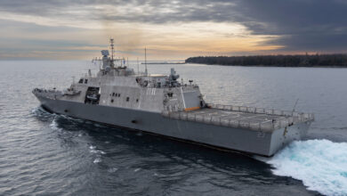 The future USS Nantucket transits the Menominee River in northern Wisconsin, departing for at-sea demonstrations during Acceptance Trials, December 6, 2023. The USS Nantucket is a testament to the enduring partnership between Nantucket, Massachusetts, and the Navy honoring the rich heritage of the people of Nantucket and the maritime legacy that the island represents.