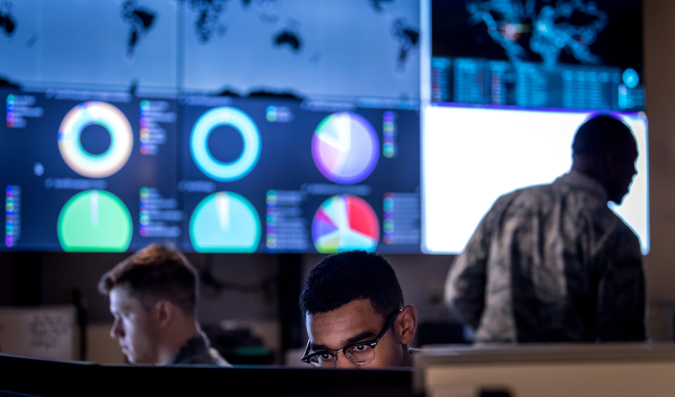 Cyber warfare operators assigned to the 275th Cyber Operations Squadron of the 175th Cyberspace Operations Group of the Maryland Air National Guard configure a threat intelligence feed for daily watch in the Hunter's Den at Warfield Air National Guard Base, Middle River, Md., Dec. 2, 2017. (U.S. Air Force photo by J.M. Eddins Jr.)