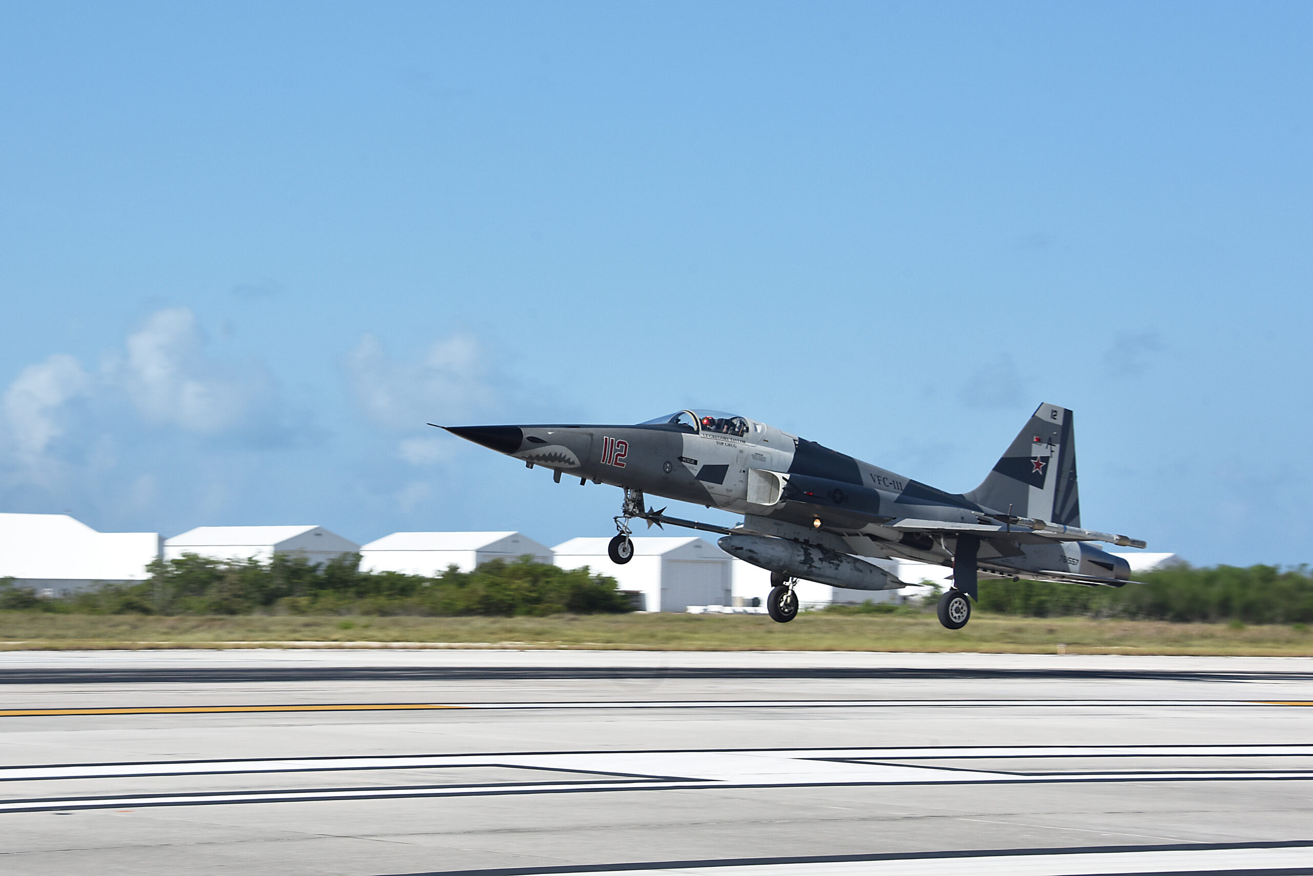 200623-N-KM072-001 KEY WEST, Fla. (June 23, 2020) An F-5N Tiger jet with Fighter Squadron Composite (VFC) 111 Sun Downers lands at Naval Air Station Key West's Boca Chica Field after training with Strike Fighter Squadron (VFA) 122 Flying Eagles June 23, 2020. Naval Air Station Key West is the state-of-the-art facility for combat fighter aircraft of all military services, provides world-class pierside support to U.S. and foreign naval vessels, and is the premier training center for surface and subsurface military operations. (U.S. Navy photo by Danette Baso Silvers)