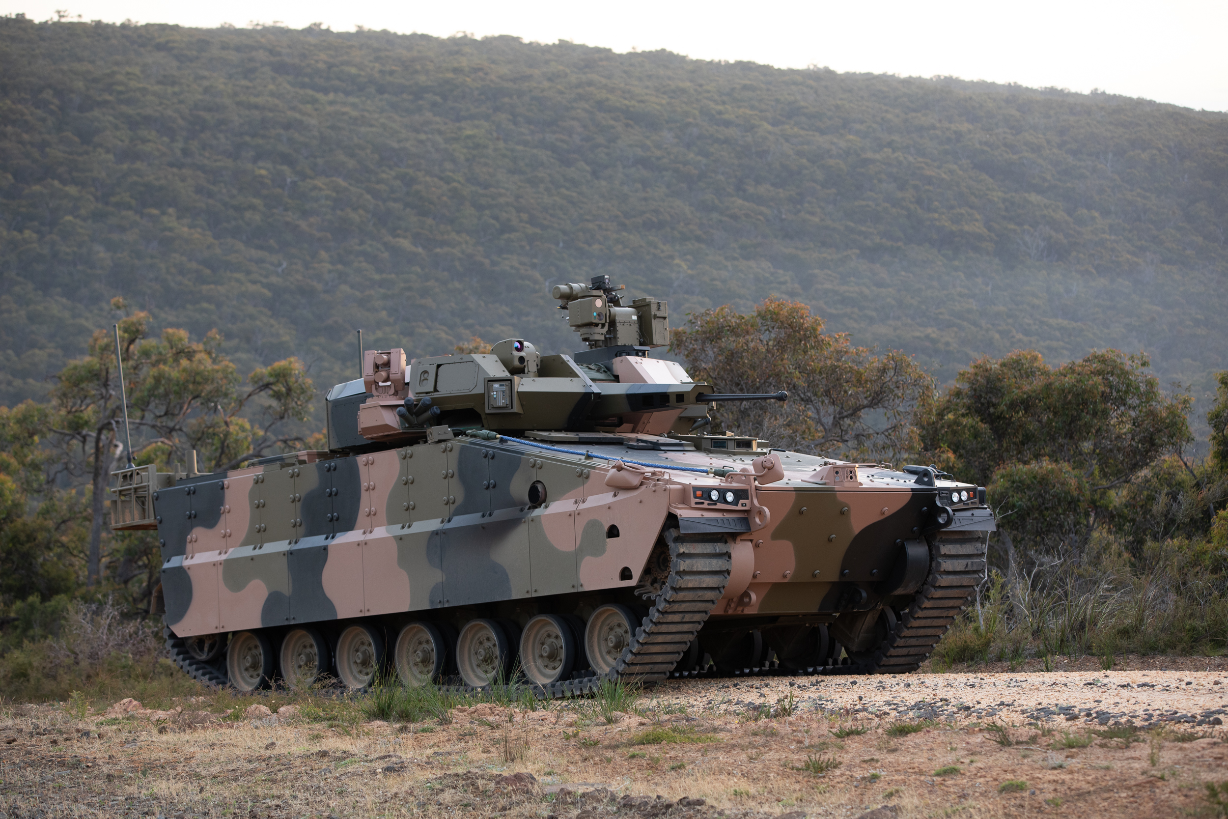 Hanwha Redback Infantry Fighting Vehicle delivered to Defence to support Test and Evaluation activities conducted as part of the LAND 400 Phase 3 Risk Mitigation Activity. Picture taken at the Australian Automotive Research Centre, Anglesea, Victoria, prior to delivery to Defence. *** Local Caption *** The LAND 400 Phase 3  Land Combat Vehicle System (Infantry Fighting Vehicle) project is scoped to deliver and support up to 450 Infantry Fighting Vehicles and a Manoeuvre Support Vehicle capability. The shortlisted tenderers, Hanwha Defense Australia and Rheinmetall Defence Australia, have each delivered three prototype test and evaluation vehicles as part of the two-year Risk Mitigation Activity. The Risk Mitigation Activity will include detailed testing and evaluation of the tendered vehicles and will provide Defence with the objective quality evidence to inform a Government decision in 2022.