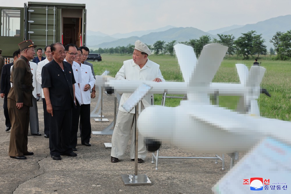 Kim Jong Un oversees a performance test of drones.