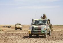 Military pick-up and an armored vehicle 'Bastion' of the Malian army.