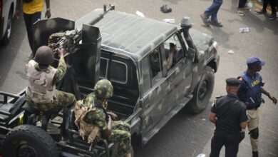 Military personnel in a vehicle in Nigeria's largest city of Lagos, 2023