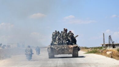 Syrian soldiers are seen in the town of Morek in the northern countryside of Hama province in central Syria, 2019