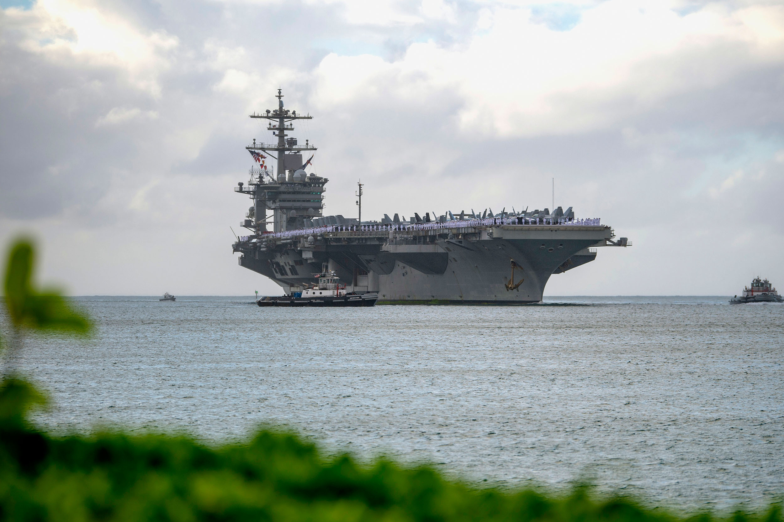 The aircraft carrier USS Abraham Lincoln (CVN 72) arrives at Joint Base Pearl Harbor-Hickam