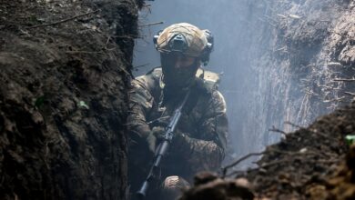 A serviceman of the 3rd Colonel Petro Bolbochan Brigade of Operational Assignment of Ukraine's National Guard is staying in the trench during a tactical exercise in Ukraine