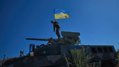 Ukrainian soldier on top of a South African Mbombe 6 armored fighting vehicle. Photo: NMFTE via Telegram