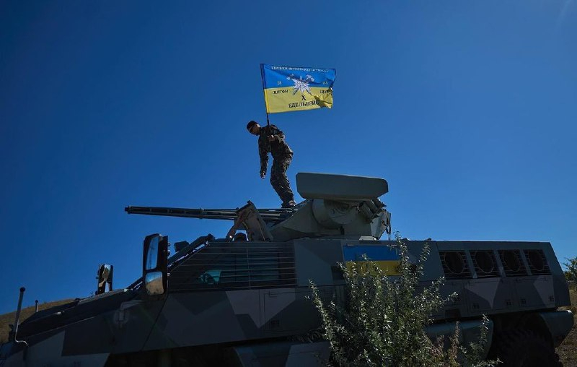 Ukrainian soldier on top of a South African Mbombe 6 armored fighting vehicle. Photo: NMFTE via Telegram