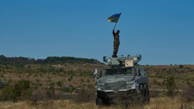 Ukrainian soldier on top of a South African Mbombe 6 armored fighting vehicle. Photo: NMFTE via Telegram