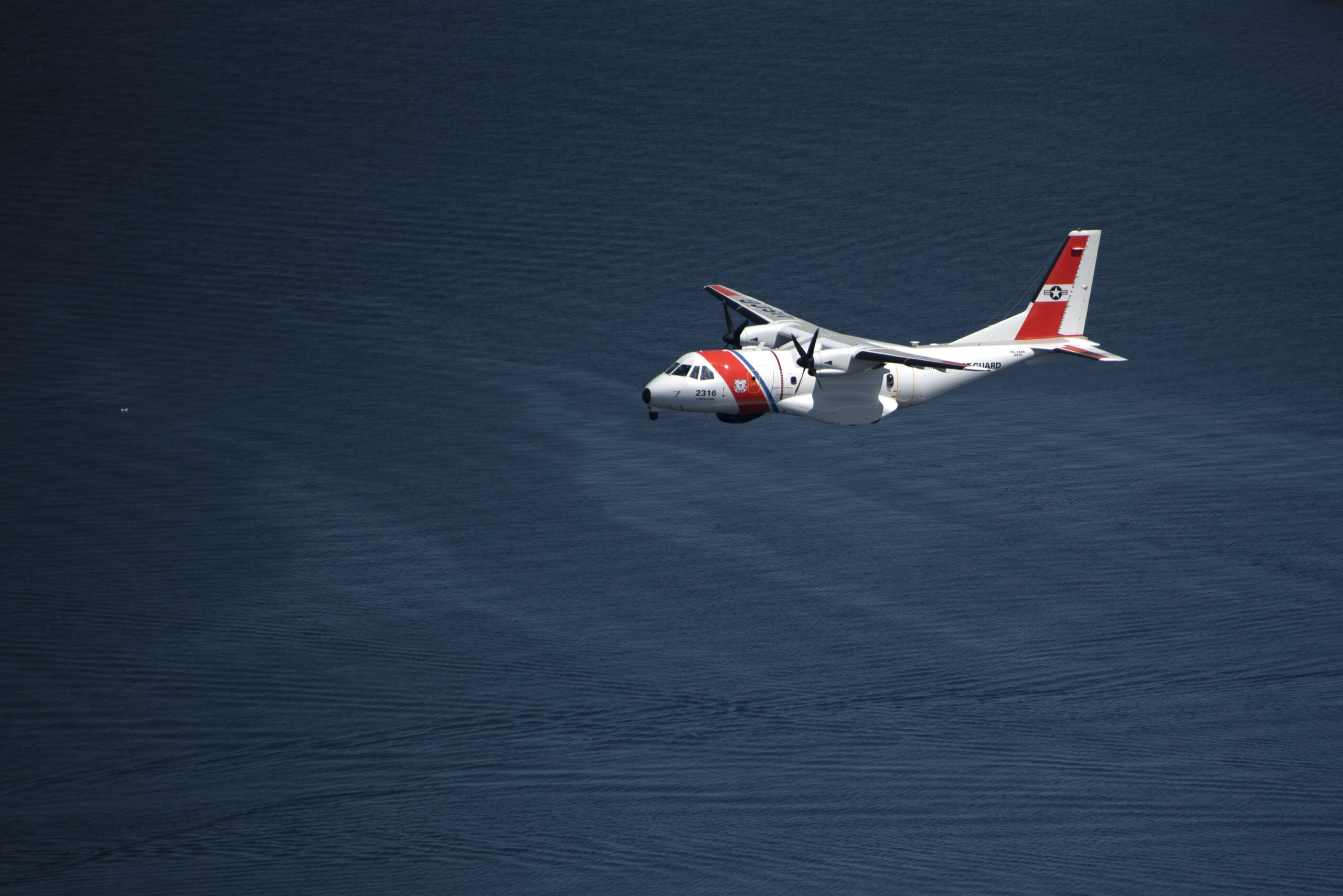 A Coast Guard Air Station Cape Cod HC-144 Ocean Sentry airplane flies over Newport, Rhode Island, Tuesday, May 8, 2018. The aircraft was part of a fly over for the opening of the Volvo Ocean Race village. (U.S Coast Guard photo by Petty Officer Andrew Barresi)