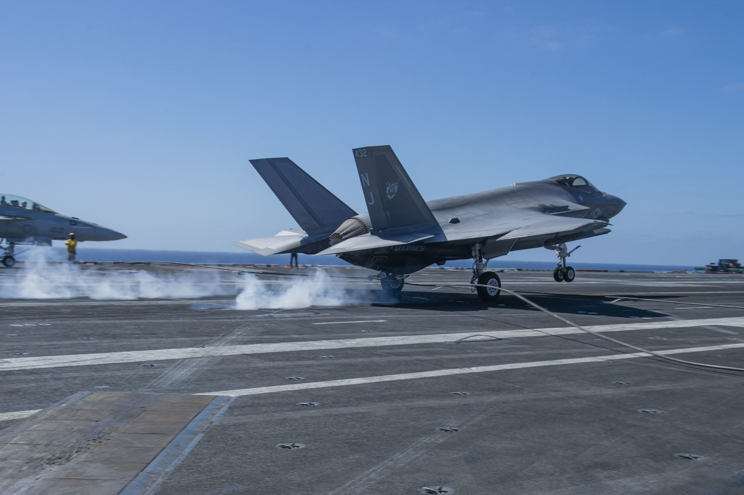 220309-N-DU622-1207 PACIFIC OCEAN (Mar. 9), An F-35C Lightning II, from the "Rough Raiders" of Strike Fighter Squadron (VFA) 125, makes an arrested gear landing on the flight deck of the aircraft carrier USS Nimitz (CVN 68). Nimitz is underway conducting routine operations. (U.S. Navy photo by Mass Communication Specialist 3rd Class Justin McTaggart)